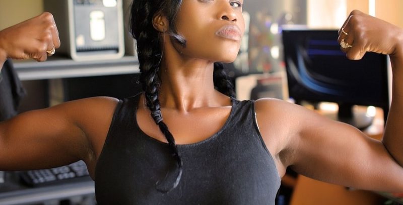black girl flexing her muscles
